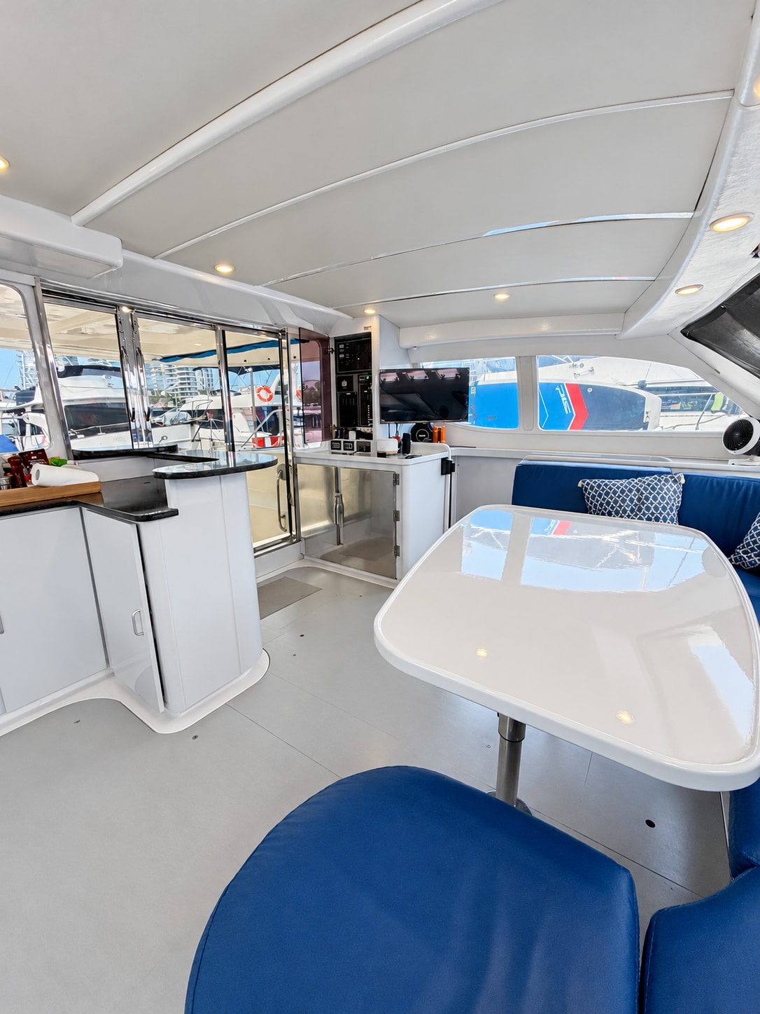 One Lotus yacht — Interior dining area looking toward the aft deck
